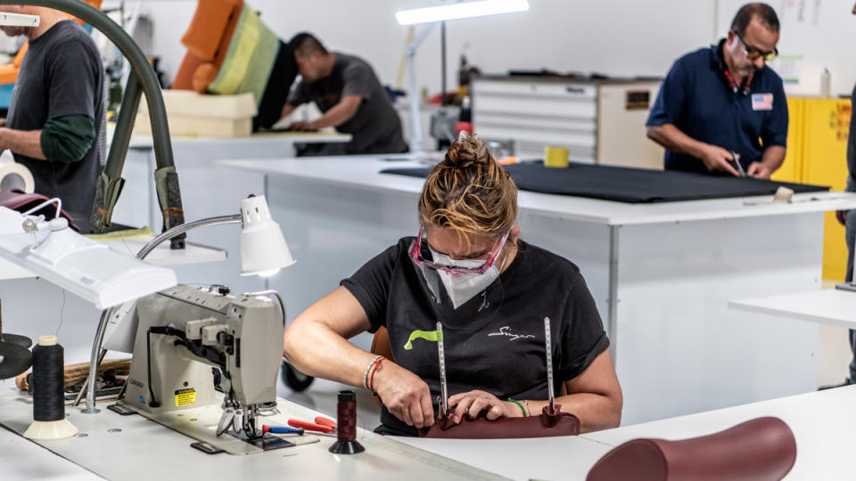 A team of technicians working at Singer Vehicle Design.