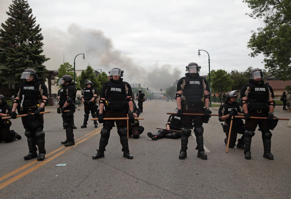 Police officers block a road 