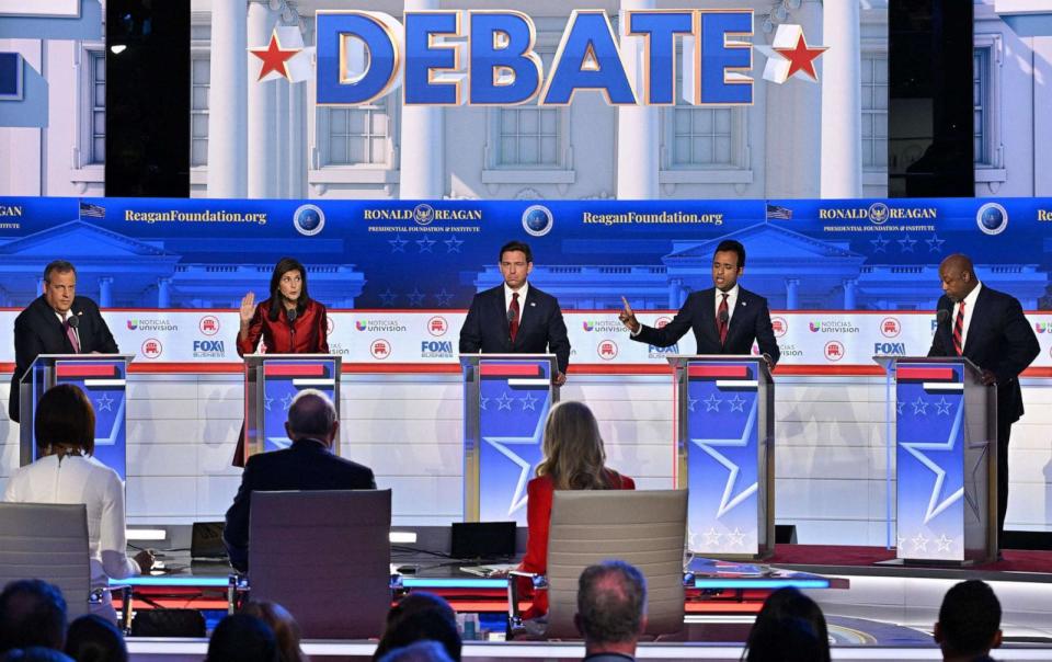 PHOTO: In this Sept. 27, 2023, file photo, Chris Christie, Fla. Gov. Ron DeSantis, and Sen. Tim Scott look on as Nikki Haley and Vivek Ramaswamy speak during the second Republican presidential primary debate in Simi Valley, Calif. (Robyn Beck/AFP via Getty Images, FILE)