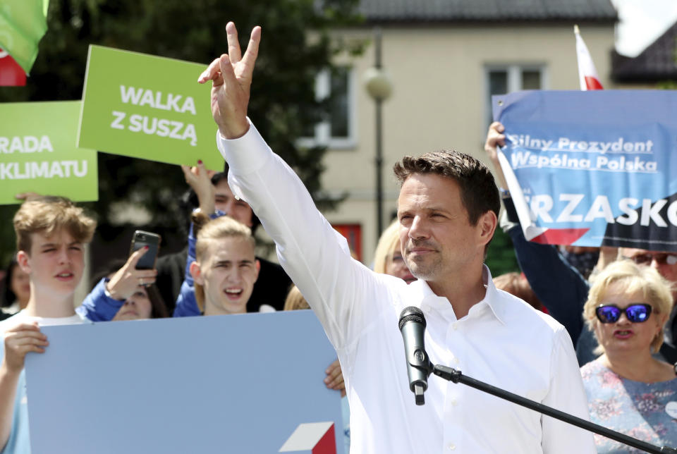 In this Thursday, July 9, 2020 photo Rafal Trzaskowski, contender in Poland's tight presidential election runoff on Sunday, July 12, 2020, gestures during a rally in Raciaz, Poland. Trzaskowski is running against incumbent conservative president, Andrzej Duda, who has backing from the ruling party. Opinion polls suggest the election may be decided by a small number of votes. (AP Photo/Czarek Sokolowski)