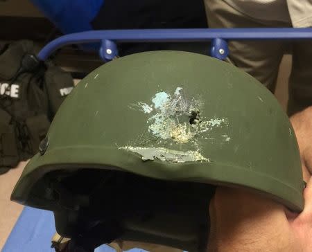 A handout photograph posted by the Orlando Police Department on Twitter with the words, "Pulse shooting: In hail of gunfire in which suspect was killed, OPD officer was hit. Kevlar helmet saved his life", in reference to the operation against a gun man inside Pulse night club in Orlando, Florida, June 12, 2016. Orlando Police Department/Handout via REUTERS