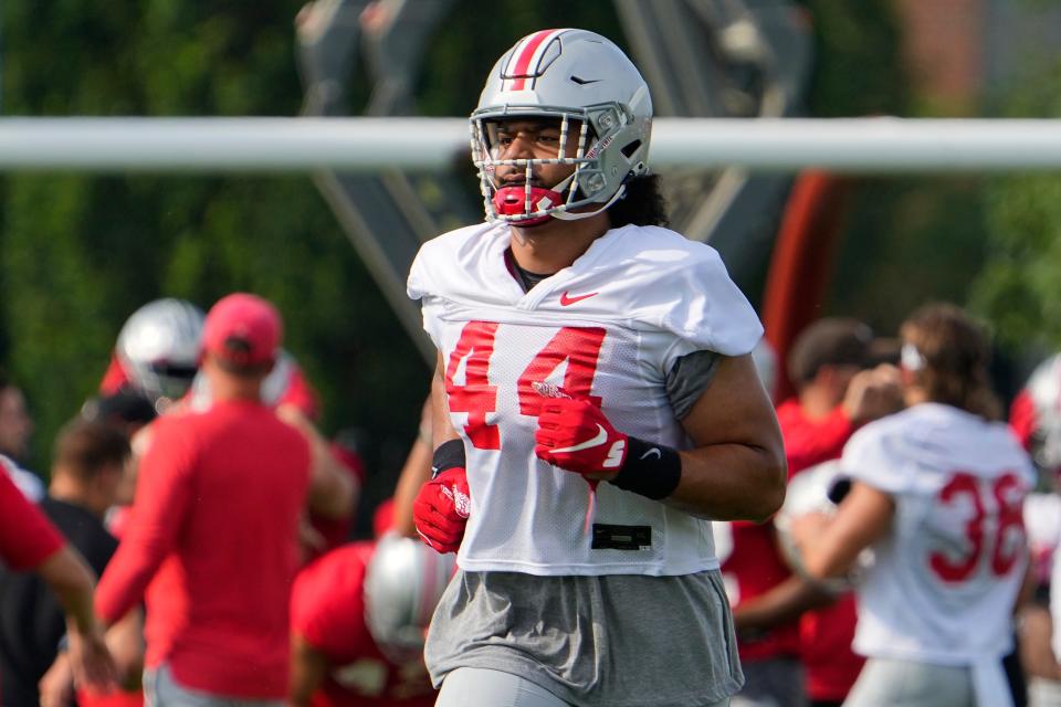 Aug 4, 2022; Columbus, OH, USA;  Ohio State Buckeyes defensive end J.T. Tuimoloau (44) runs during the first fall football practice at the Woody Hayes Athletic Center. Mandatory Credit: Adam Cairns-The Columbus Dispatch