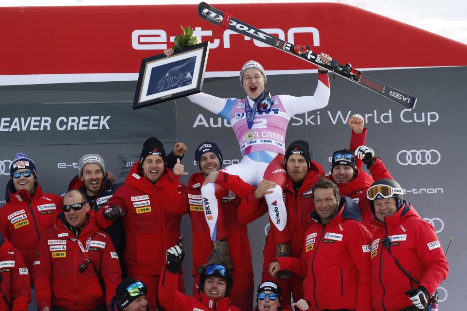 Switzerland's Marco Odermatt celebrates with teammates after he won the Men's World Cup super-G skiing race Friday, Dec. 6, 2019, in Beaver Creek, Colo. (AP Photo/John Locher)