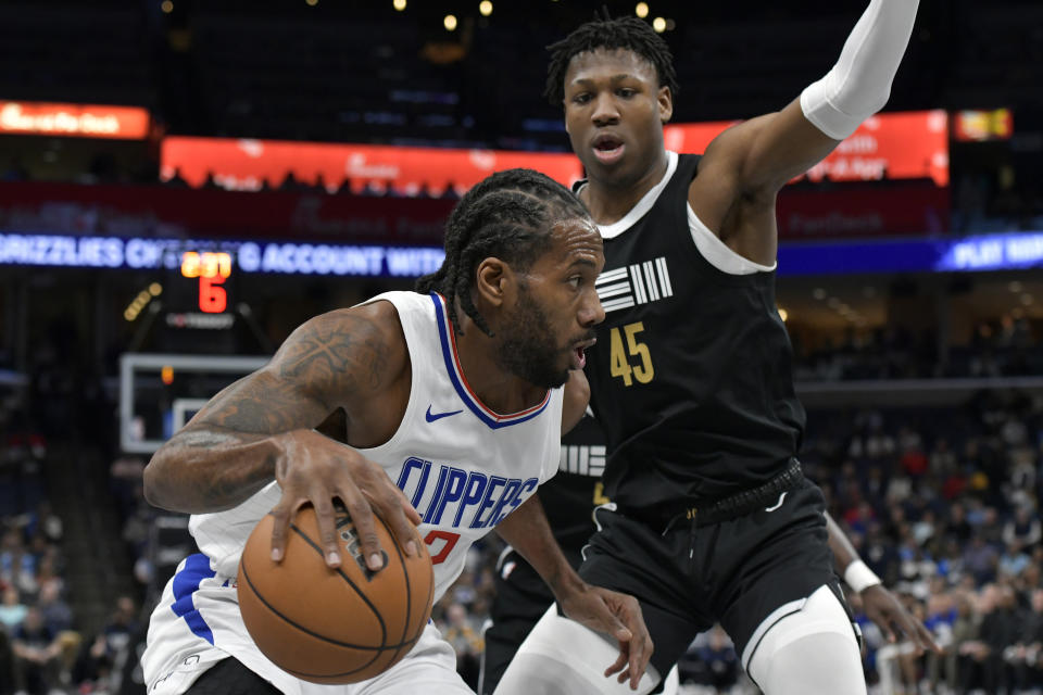 Los Angeles Clippers forward Kawhi Leonard (2) is defended by Memphis Grizzlies forward GG Jackson II (45) during the first half of an NBA basketball game Friday, Feb. 23, 2024, in Memphis, Tenn. (AP Photo/Brandon Dill)