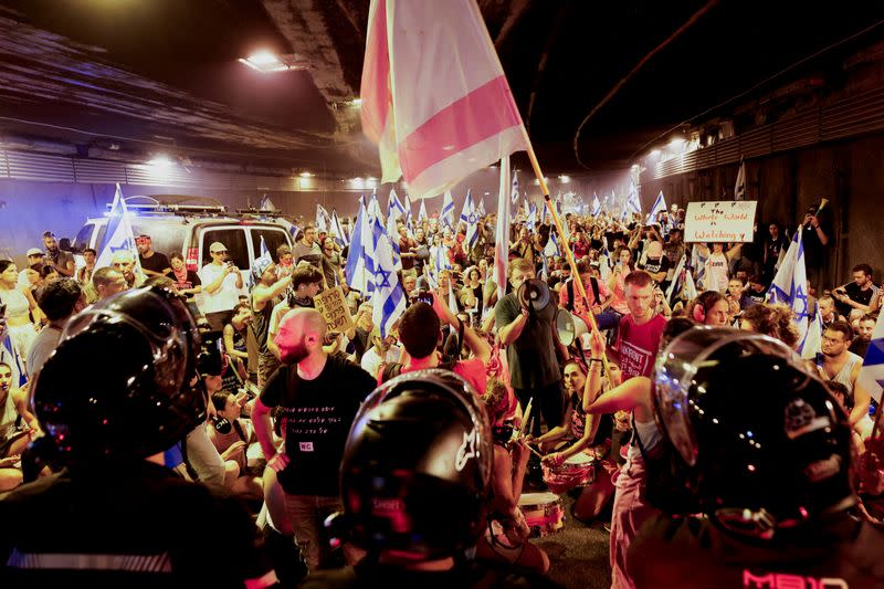 Protesters demonstrate against Israeli PM Netanyahu and his nationalist coalition government's judicial overhaul, in Tel Aviv