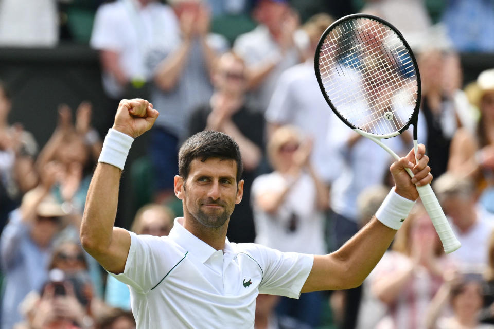Serbia's Novak Djokovic celebrates beating Australia's Thanasi Kokkinakis during their men's singles tennis match on the third day of the 2022 Wimbledon Championships at The All England Tennis Club in Wimbledon, southwest London, on June 29, 2022. - RESTRICTED TO EDITORIAL USE (Photo by SEBASTIEN BOZON / AFP) / RESTRICTED TO EDITORIAL USE (Photo by SEBASTIEN BOZON/AFP via Getty Images)
