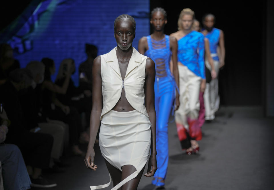 Models wear creations for the Drome Spring Summer 2022 collection during Milan Fashion Week, in Milan, Italy, Thursday, Sept. 23, 2021. (AP Photo/Antonio Calanni)