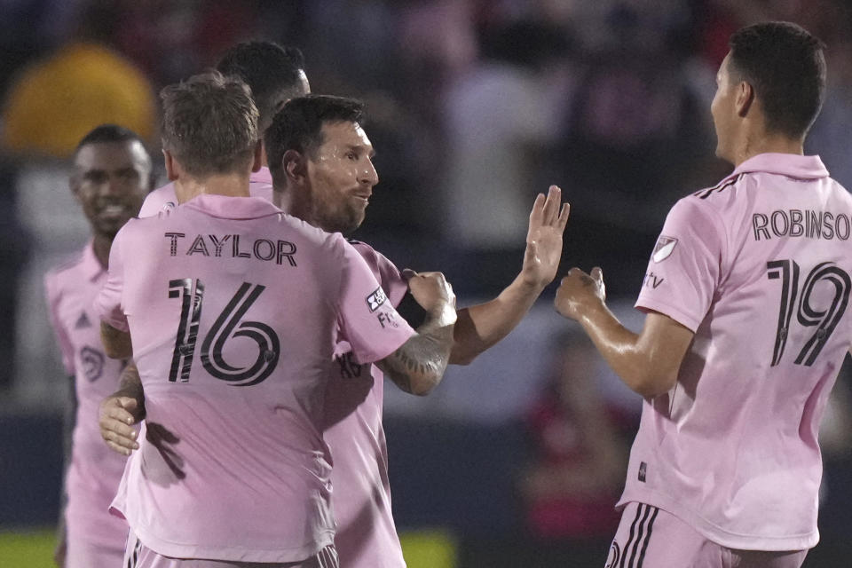 Inter Miami forward Lionel Messi is congratulated by Robert Taylor (16) and Robbie Robinson (19) after Messi scored against FC Dallas during the second half of a Leagues Cup soccer match Sunday, Aug. 6, 2023, in Frisco, Texas. (AP Photo/LM Otero)