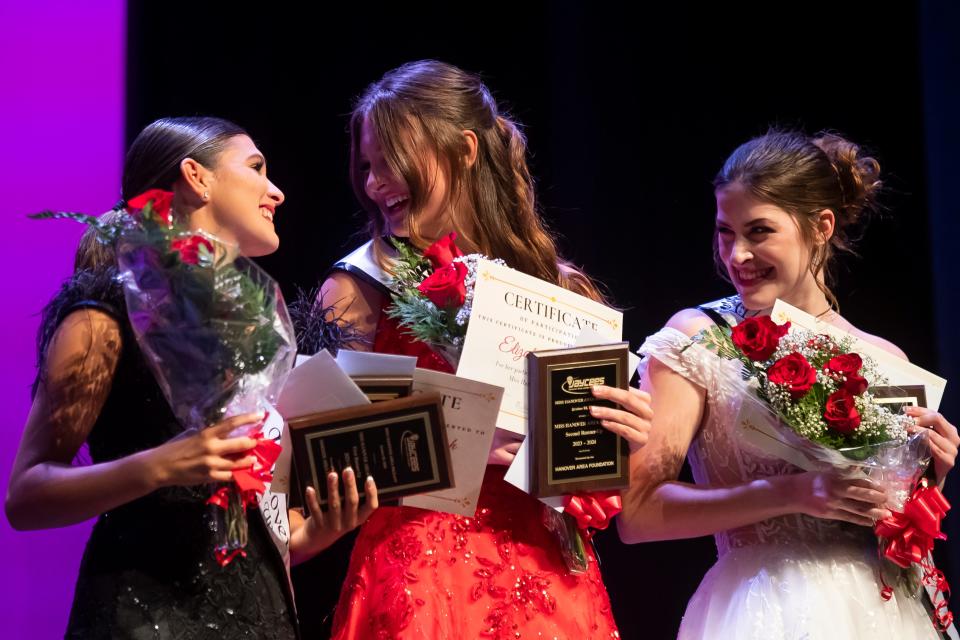 (From left) Carolyne Rohrbaugh, Elizabeth Huston and McKenna Kerley smiles on stage after being named first, second and third runners-up, respectively, during the 55th Miss Hanover Area Pageant at the Eichelberger Performing Arts Center on Monday, Oct. 23, 2023, in Hanover.