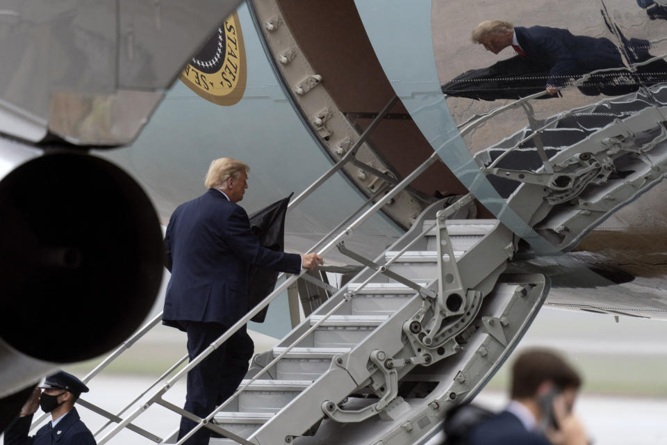 President Donald Trump boards Air Force One, Monday, Oct. 12, 2020, at Andrews Air Force Base, Md. Trump is en route to Florida. (AP Photo/Alex Brandon)