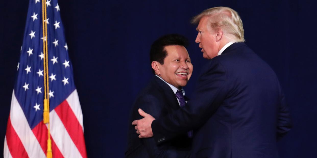 President Donald Trump, right, embraces Pastor Guillermo Maldonado during a rally for evangelical supporters at the King Jesus International Ministry church, Friday, Jan. 3, 2020, in Miami.