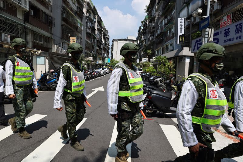 FILE PHOTO: Military police officers get into position for a drill in Taipei