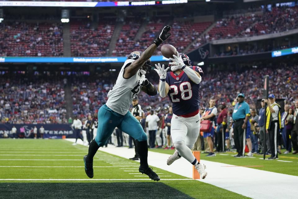 Jaguars outside linebacker Josh Allen breaks up a pass in the end zone intended for Texans running back Rex Burkhead during Sunday's game in Houston. The Jaguars won 31-3.