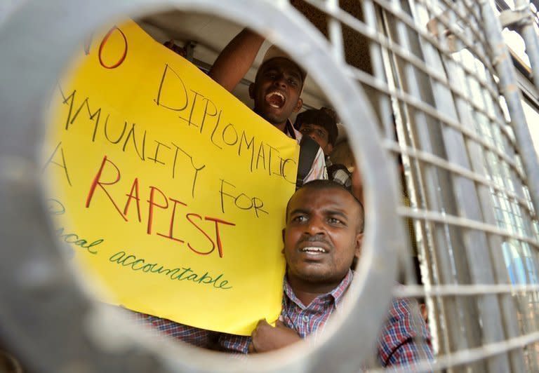 Indian activists from 'Campaign Against Child Labour' hold posters and shout slogans after they were arrested during a demonstration in Bangalore, on June 18, 2012. The Indian wife of a French consular official charged with raping their daughter has demanded a meeting with Francois Hollande, presenting the French president with a thorny diplomatic dilemma on his first state visit to India