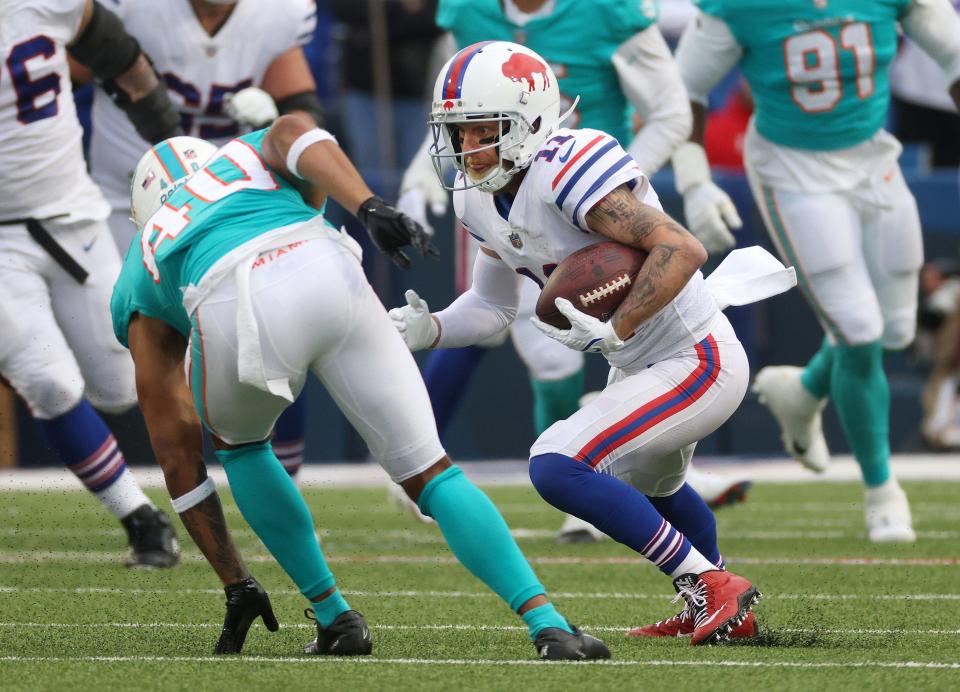 Cole Beasley looks for extra yards on one of his ten catches. 