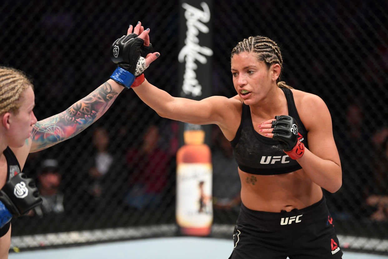 DENVER, CO - NOVEMBER 10:  (R-L) Ashley Yoder and Amanda Cooper touch gloves to the start of round two in their women's strawweight bout during the UFC Fight Night event inside Pepsi Center on November 10, 2018 in Denver, Colorado. (Photo by Josh Hedges/Zuffa LLC/Zuffa LLC via Getty Images)