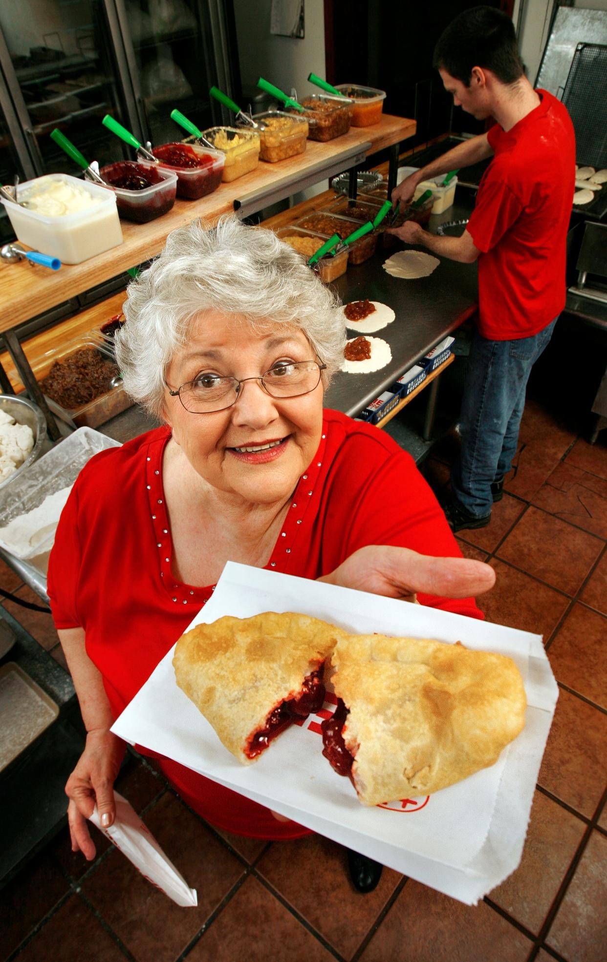 In this file photo, Nancy Fulton shows a cherry pie at Original Fried Pies near Davis.