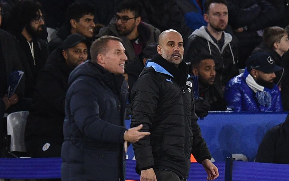 Leicester City's manager Brendan Rodgers and Manchester City's manager Pep Guardiola gesture during the English Premier League football match between Leicester City and Manchester City at King Power Stadium - GETTY IMAGES