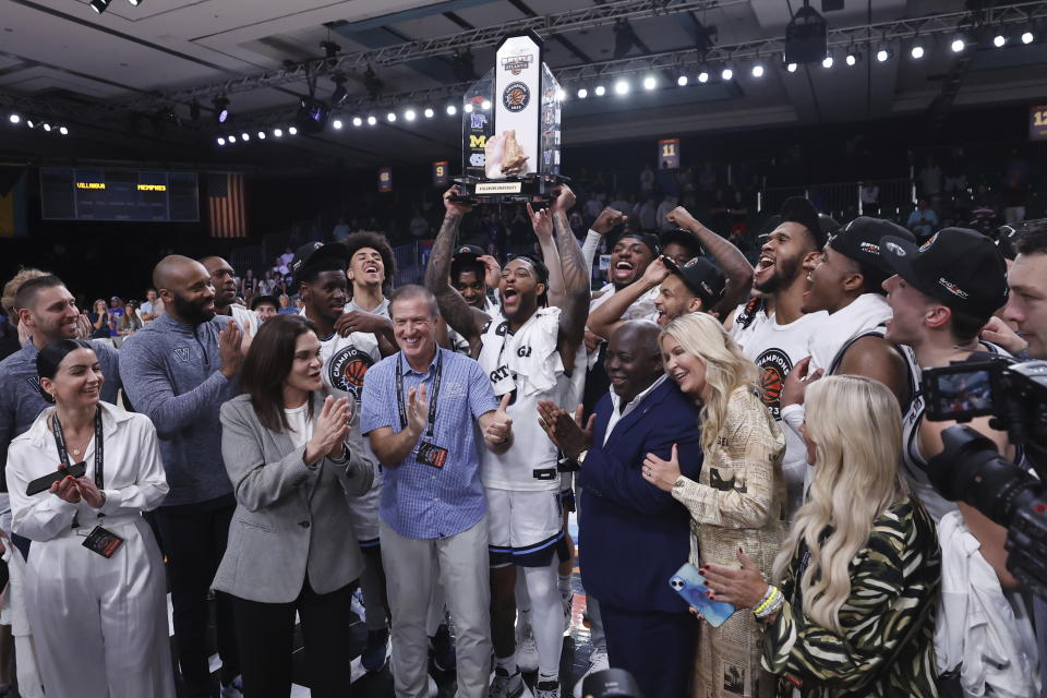 Villanova's Justin Moore with his MVP trophy after Villanova's championship win during an NCAA college basketball game in the Battle 4 Atlantis at Paradise Island, Bahamas, Friday, Nov. 24, 2023. (Tim Aylen/Bahamas Visual Services via AP)