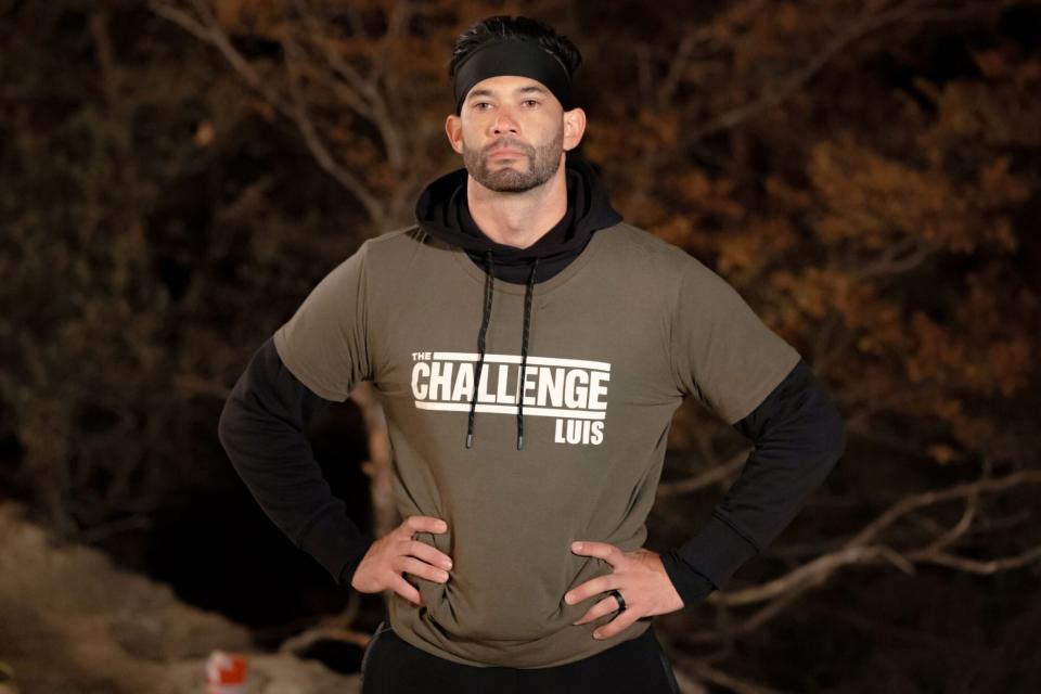 “Double Crossed and Sideswiped” – Host TJ Lavin reveals a shocking double elimination leaving the Challengers scrambling to win a high-stakes, adrenaline filled semi-truck challenge to ensure their survival in the game, on THE CHALLENGE: USA, Sunday, Aug. 20 (9:00-10:00 PM, ET/PT) on the CBS Television Network and streaming on Paramount+ (live and on demand for Paramount+ with SHOWTIME subscribers, or on demand for Paramount+ Essential subscribers the day after the episode airs). Pictured: Luis Colon. Photo by Jonne Roriz, courtesy of Paramount ©2023 Paramount, All Rights Reserved.