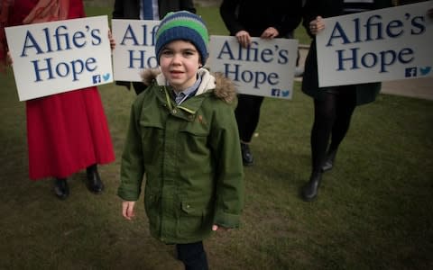 Alfie Dingley with supporters in Westminster, London - Credit: Stefan Rousseau/PA Wire