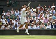 Novak Djokovic of Serbia jumps for a shot during his match against Jarkko Nieminen of Finland at the Wimbledon Tennis Championships in London, July 1, 2015. REUTERS/Toby Melville