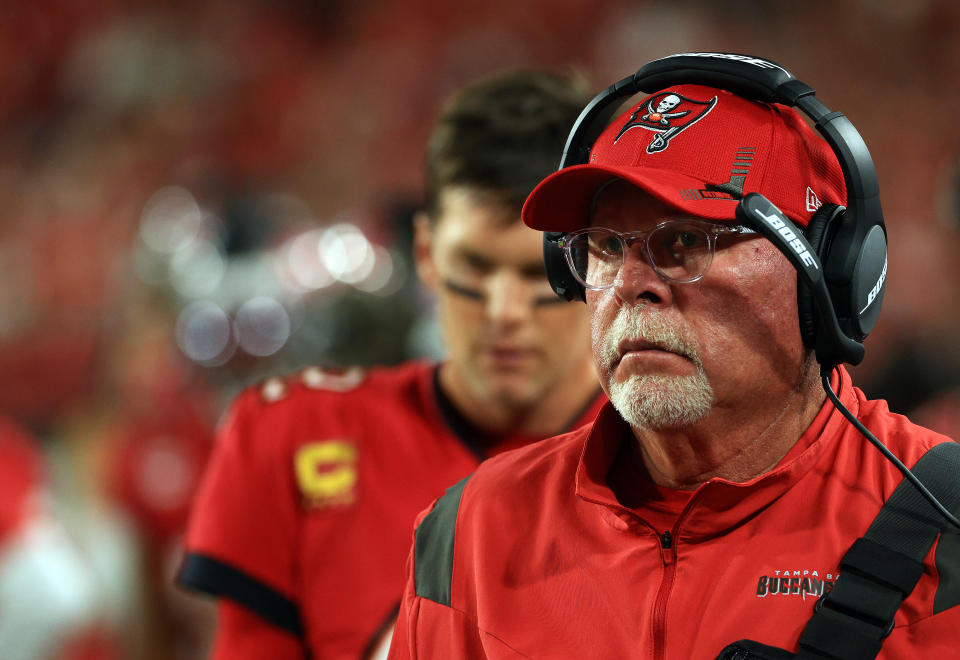 TAMPA, FLORIDA - DECEMBER 19:  Head coach Bruce Arians and quarterback Tom Brady #12 of the Tampa Bay Buccaneers watch from the sidelines during the game against the New Orleans Saints at Raymond James Stadium on December 19, 2021 in Tampa, Florida. (Photo by Mike Ehrmann/Getty Images)