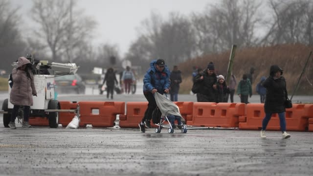 Migrant families evacuated from Floyd Bennett Field.