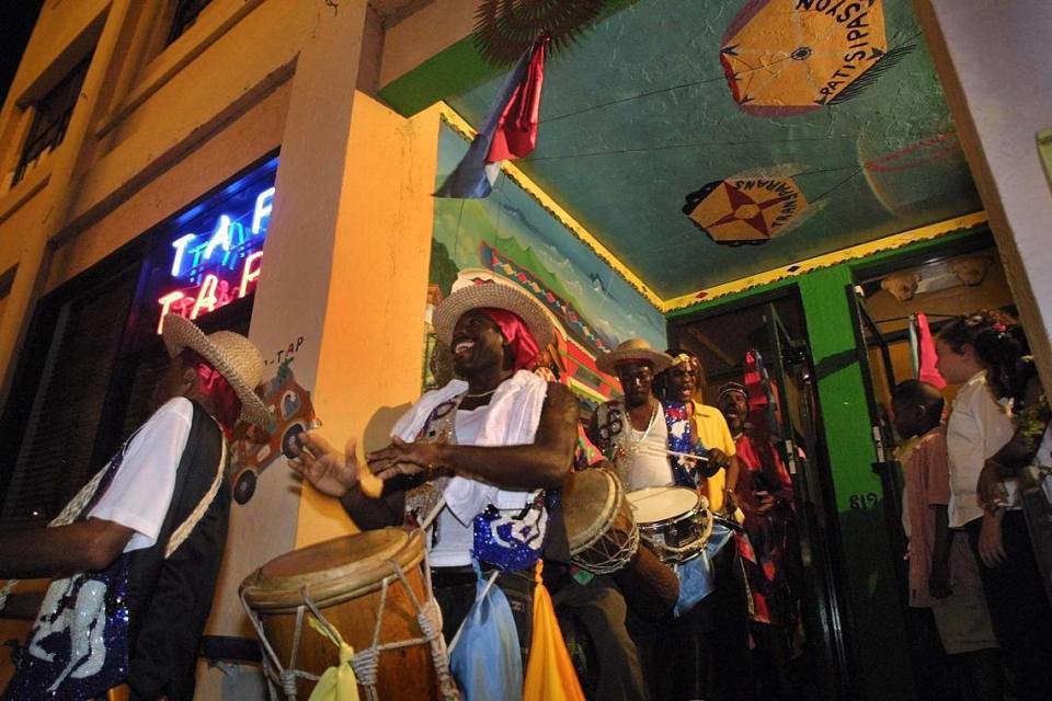 Dancers and musicians get ready at Tap Tap restaurant for the Fet Ra Ra musical parade in Miami Beach in 2002.