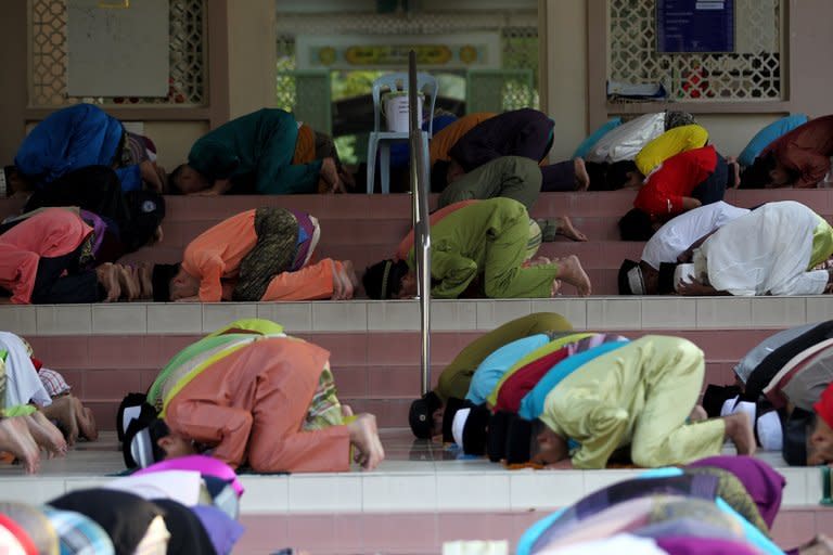 Malaysian Muslims offer prayers during Eid al-Fitr at a mosque in Kuala Lumpur on August 19, 2012. Malaysia has been rated the world's top Muslim-friendly holiday destination in a survey that listed Egypt, Turkey, United Arab Emirates, Saudi Arabia and Singapore as runners-up