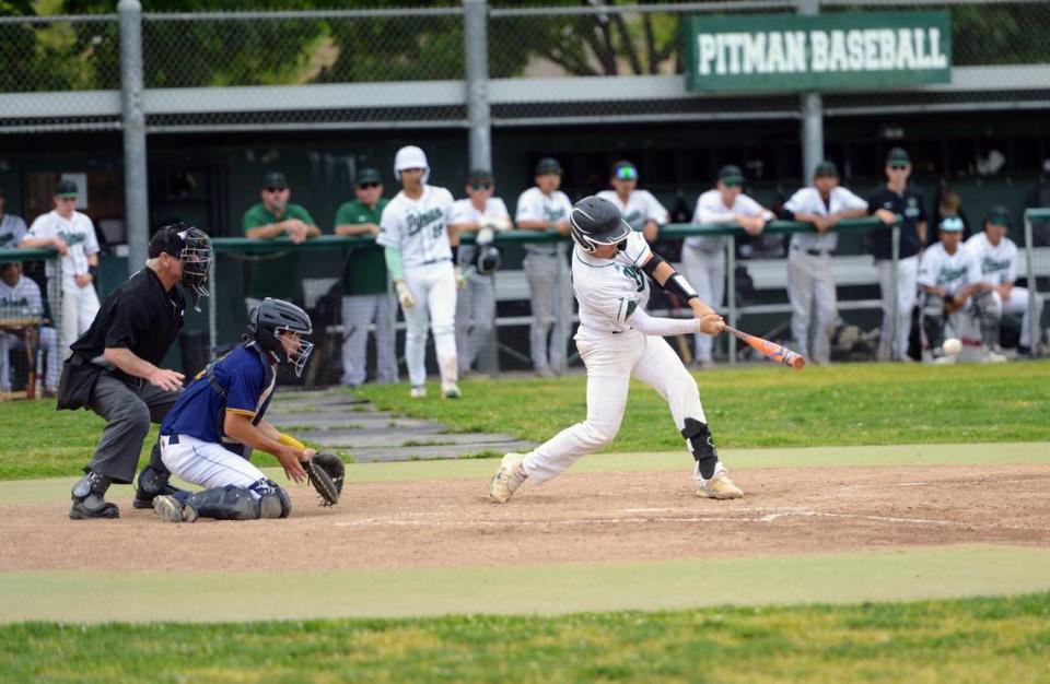 Pitman’s Alejandro Trujillo puts a pitch in play during a CCAL matchup with Gregori at Pitman High School in Turlock, Calif. on Wednesday, April 24, 2024.