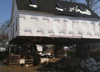 derossett house lifted above floodplain