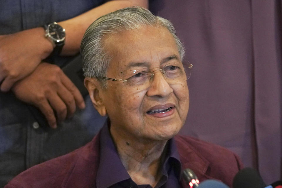 FILE - In this Feb. 22, 2020, file photo, Malaysian Prime Minister Mahathir Mohamad, speaks during a press conference in Putrajaya, Malaysia. Malaysia's alliance government under 94-year-old Prime Minister Mahathir is threatening to unravel less than two years after a historic election victory ousting the coalition that had ruled the country since independence.(AP Photo/Vincent Thian)