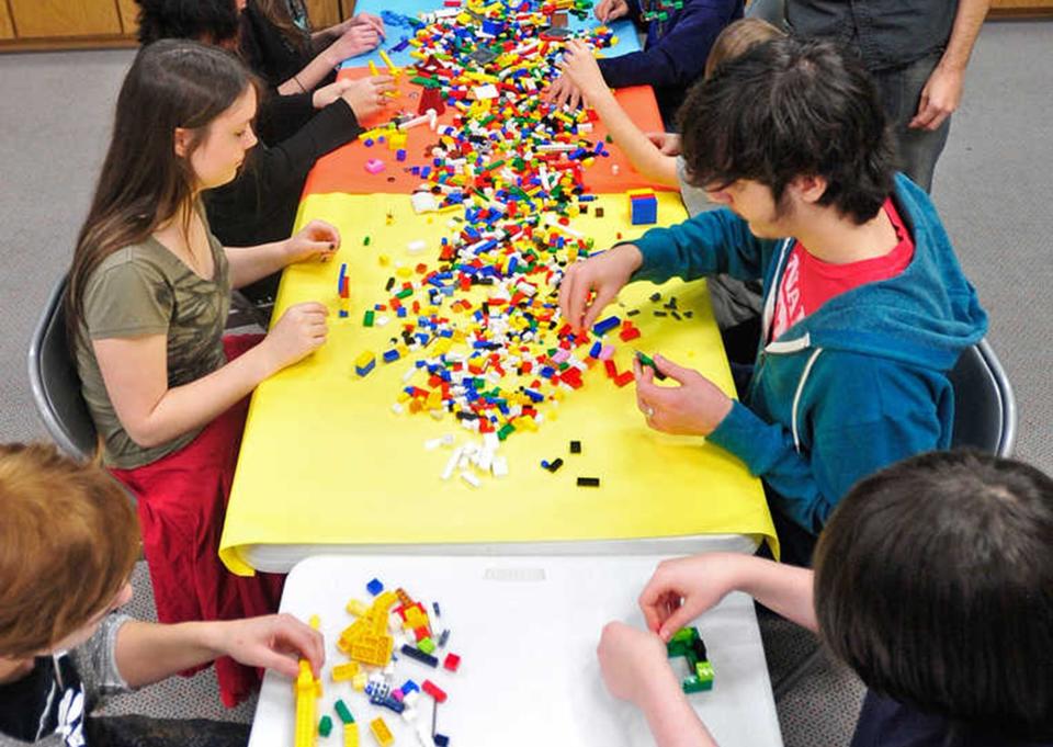 A group of young Lego enthusiasts sort through a pile of the building block toys at the Lego Club on Wednesday, Jan. 11, 2012 at the Athens-Clarke Public Library.