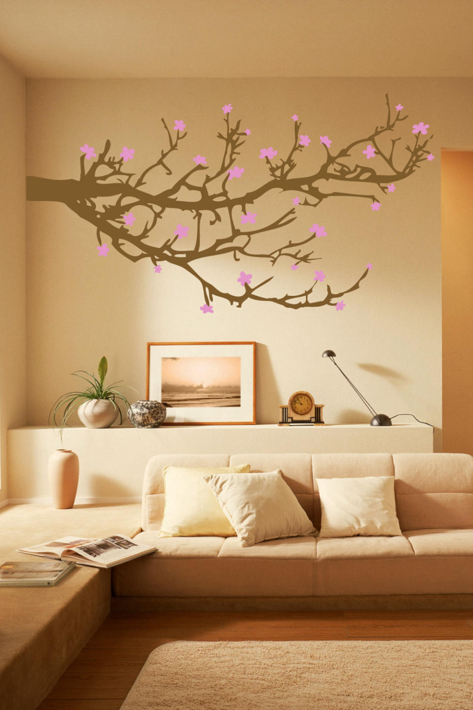 This undated publicity photo released by courtesy of WALLTAT.com shows a "Branches and Blossoms" wall decal. The decals are growing in popularity because they can easily be installed and removed without damaging walls or paint. (AP Photo/Courtesy of WALLTAT.com)