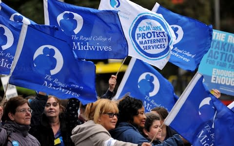Midwives on strike in 2014 - Credit: PAUL ELLIS/AFP/Getty Images