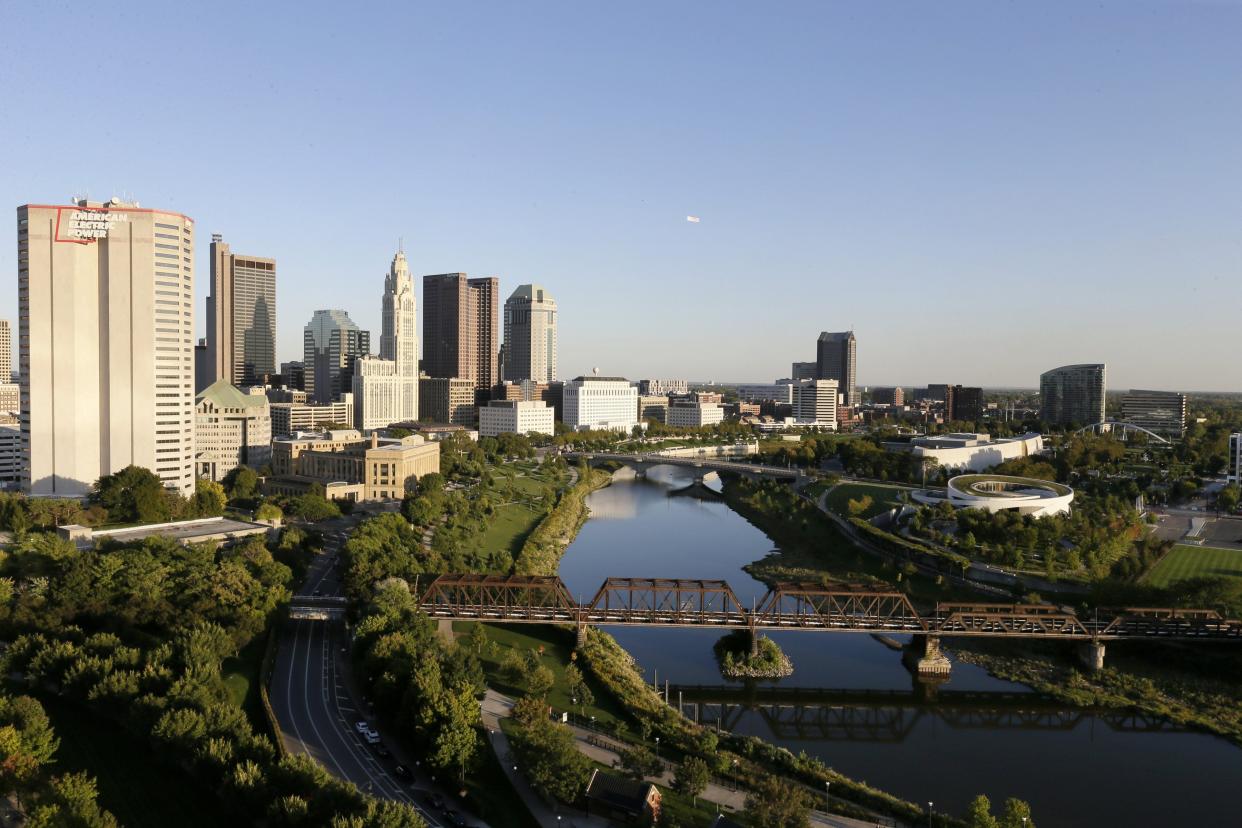 A view of the Downtown Columbus skyline along the Scioto River looking southeast from the North Bank Condominiums in the Arena District.