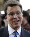 Attorney Mark Lanier answers questions outside the U.S. Federal courthouse, Monday, Oct. 21, 2019, in Cleveland. The nation's three dominant drug distributors and a big drugmaker have reached an over $200 million deal to settle a lawsuit related to the opioid crisis just as the first federal trial over the crisis was due to begin Monday. (AP Photo/Tony Dejak)