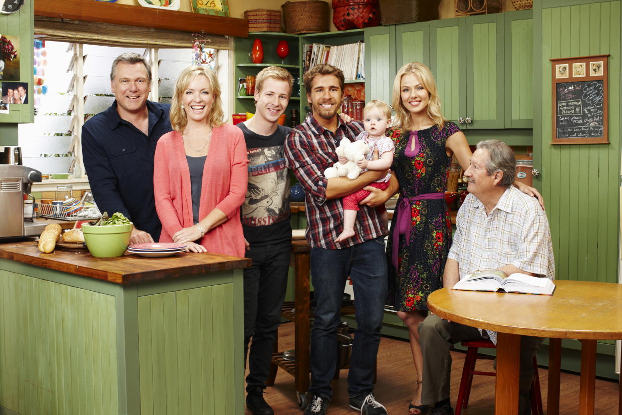 A photo of Packed To The Rafters cast members Rebecca Gibney (Julie Rafter), Erik Thomson (Dave Rafter), Jessica Marais (Rachel Rafter), Hugh Sheridan (Ben Rafter), Angus McLaren (Nathan Rafter)