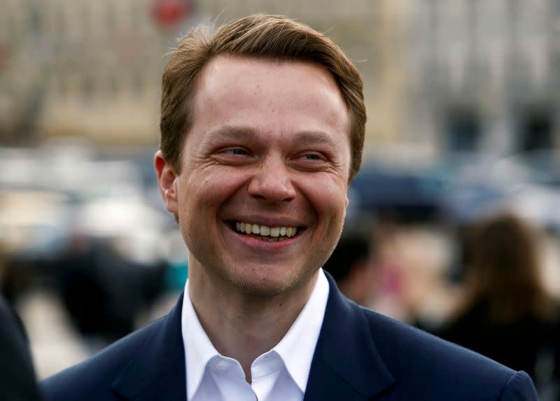 FILE PHOTO: Liksutov, Deputy Mayor of Moscow and Head of the Department for Transport and Road Infrastructure Development, smiles during a meeting with cyclists in Moscow