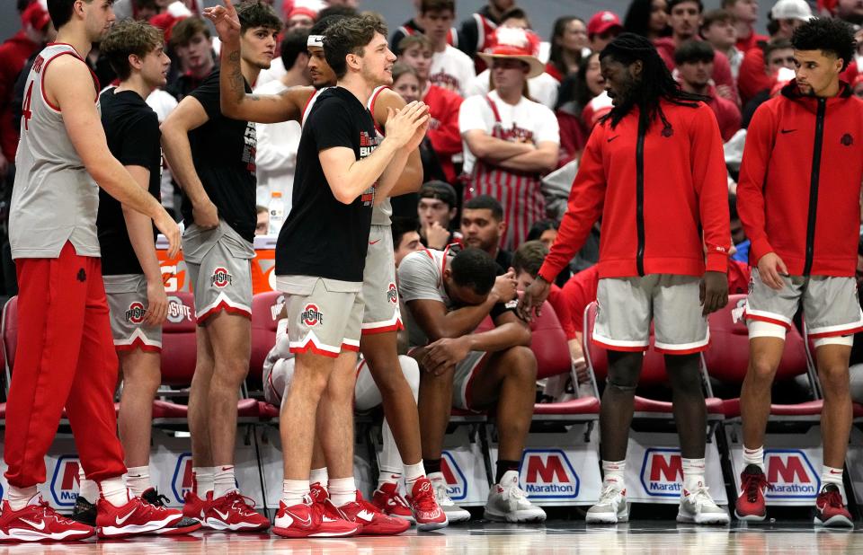 Feb 12, 2023; Columbus, OH, USA; Ohio State Buckeyes forward Zed Key (23) is consoled by teammates after leaving the court during their NCAA Mens Division I Basketball Game at Value City Arena. Mandatory Credit: Brooke LaValley/Columbus Dispatch