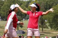 Aug 18, 2017; West Des Moines, IA, USA; USA golfer Danielle Kang celebrates after making a putt on the 18th hole to win the match during the first round morning session during The Solheim Cup international golf tournament at Des Moines Golf and Country Club. Mandatory Credit: Brian Spurlock-USA TODAY Sports