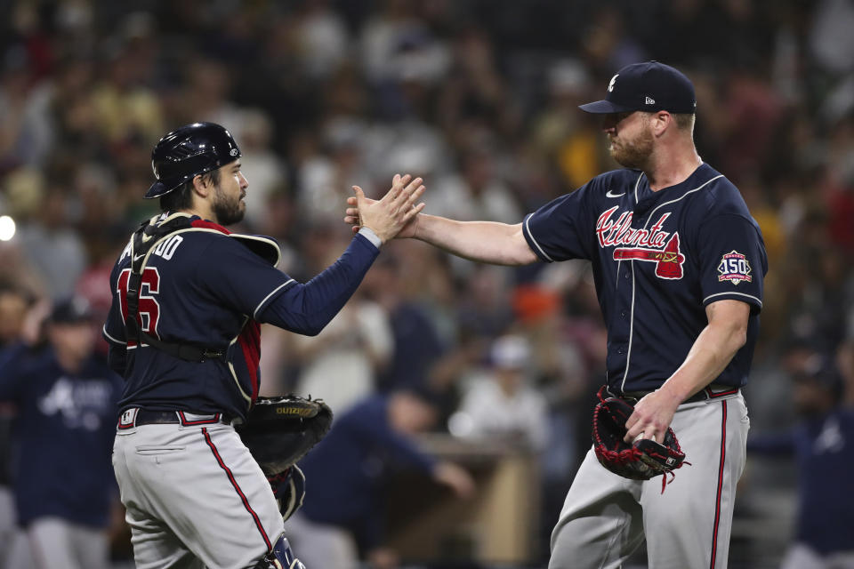 Atlanta Braves relief pitcher Will Smith, right, celebrates with catcher Travis d'Arnaud (16) after they defeated the San Diego Padres in a baseball game Saturday, Sept. 25, 2021, in San Diego. (AP Photo/Derrick Tuskan)