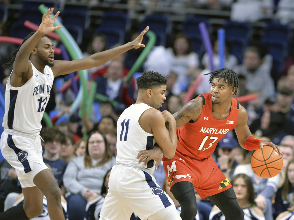 Maryland's Hakim Hart (13) is defended by Penn State's Camren Wynter (11) during the first half of an NCAA college basketball game, Sunday, March 5, 2023, in State College, Pa. (AP Photo/Gary M. Baranec)