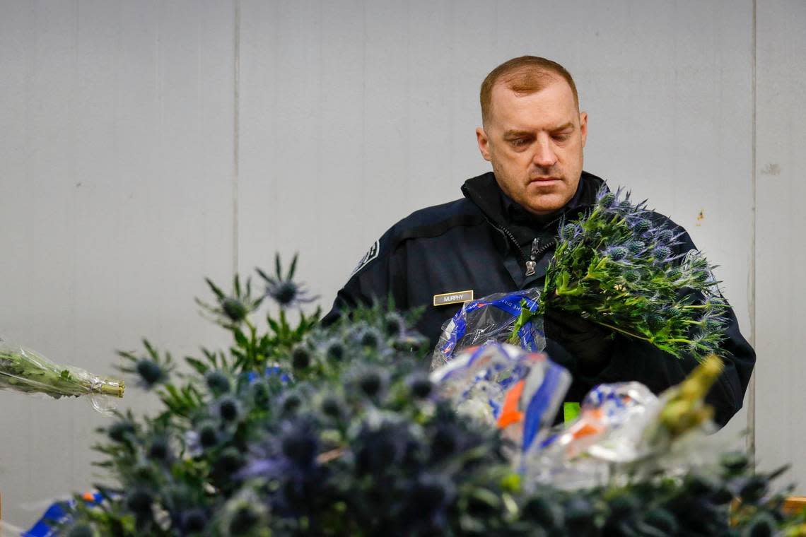 A U.S. Customs and Border Protection agriculture specialist inspects flowers for harmful pests arriving at Miami International Airport on Monday, Feb. 6, 2023.