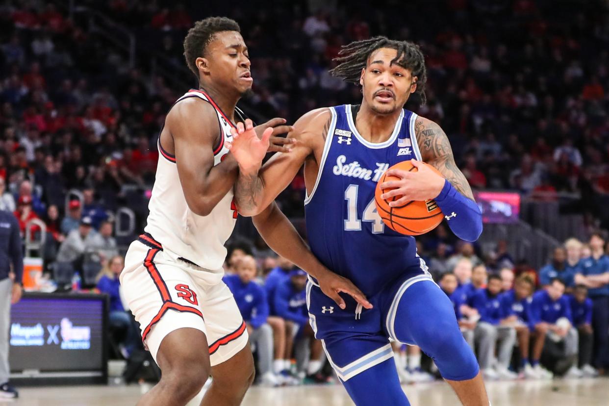 Feb 18, 2024; Elmont, New York, USA; Seton Hall Pirates guard Dre Davis (14) looks to drive past St. John's Red Storm guard Nahiem Alleyne (4) in the first half at UBS Arena. Mandatory Credit: Wendell Cruz-USA TODAY Sports