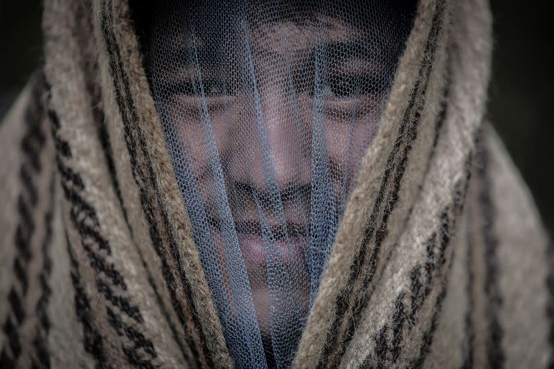 The Wider Image: Nepal's honey gatherers say fewer hives threaten tradition