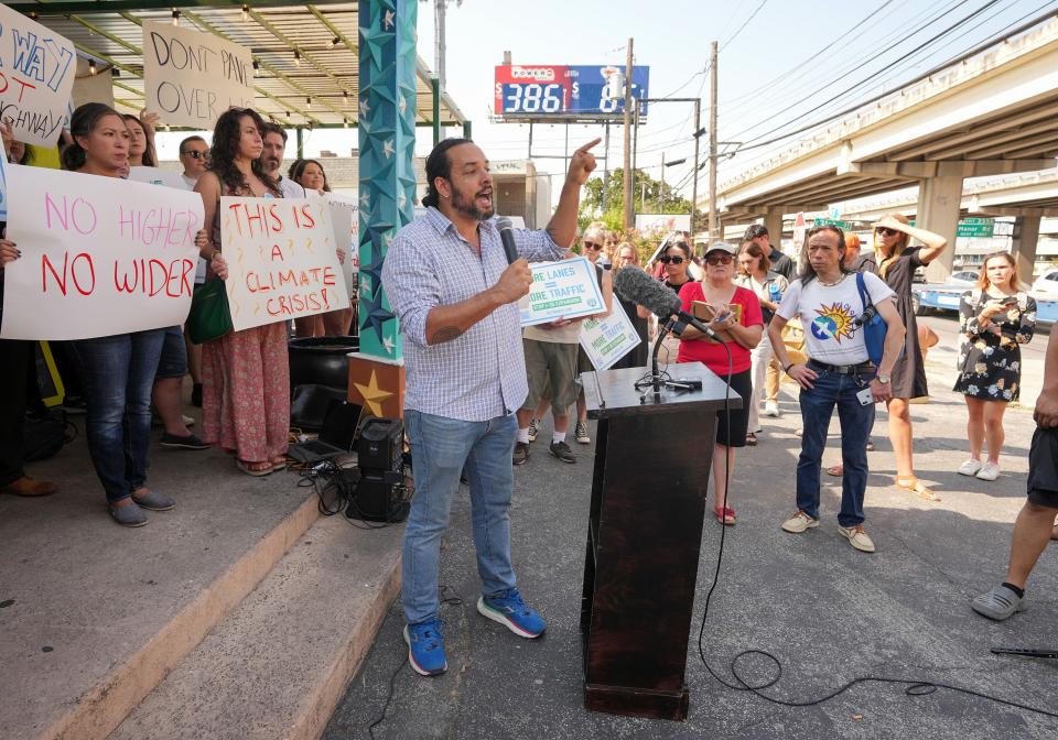 Joao Paulo Connolly of the Austin Justice Coalition speaks at a protest against the I-35 expansion plans at Stars Cafe, which sits right next to the highway in the Cherrywood neighborhood, on Wednesday August 30, 2023.
