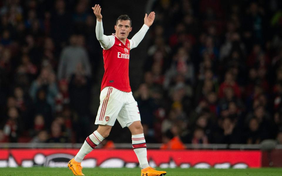 Granit Xhaka of Arsenal reacts to the crowd after being substituted by Manager Unai Emery  - Getty Images