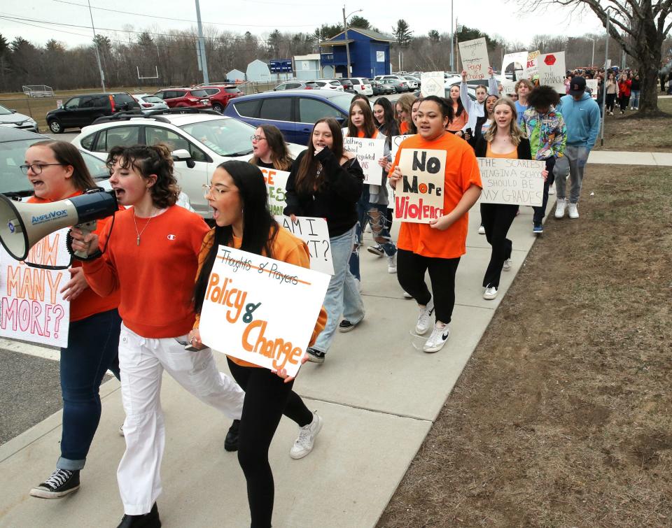 Senior Megan Burgess leads students in a chant Wednesday, during a walkout at Somersworth High School in New Hampshire to raise awareness about school shootings and gun violence.